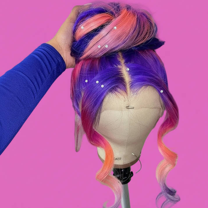 Multicolored wig on a mannequin head with a blurred background