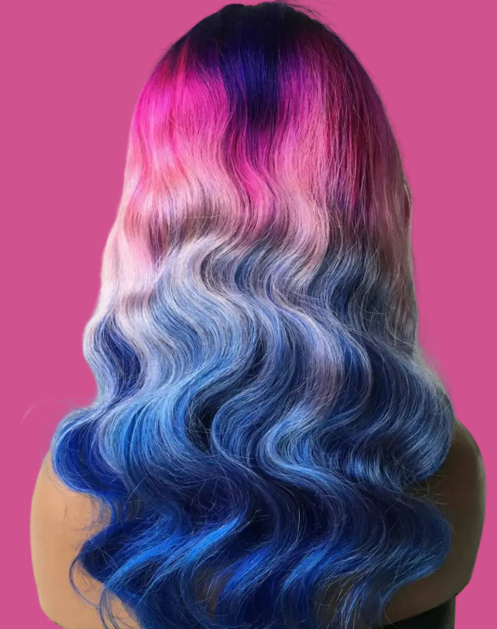 Person with wavy hair transitioning from blue to pink,